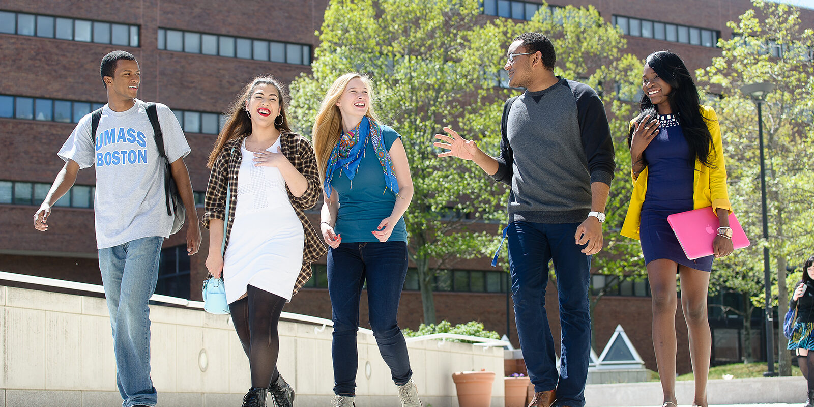 UMass Boston Students walking, laughing.